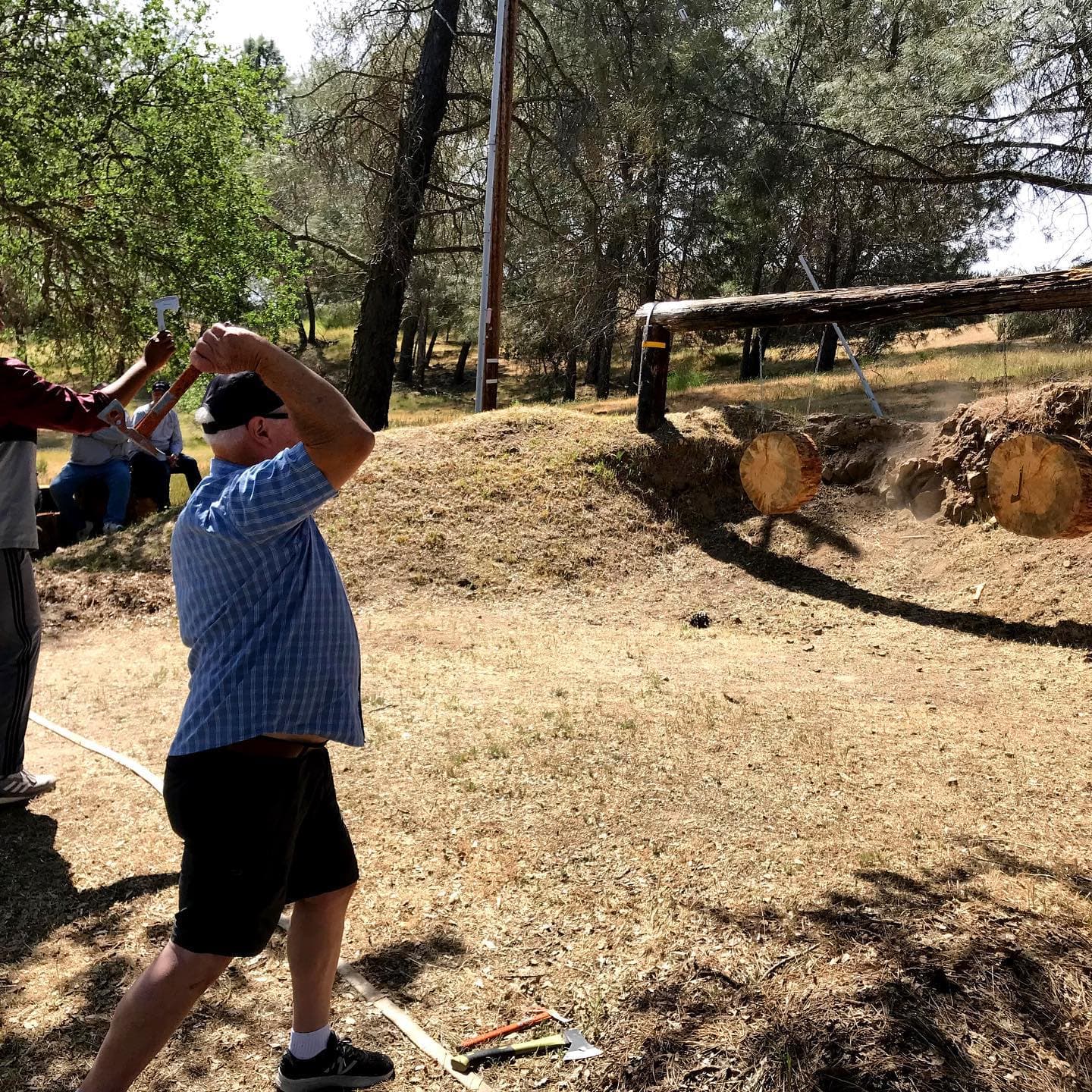 A man throwing a hatchet at a target range